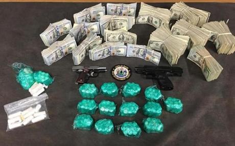 Suspected drugs and cash seized by Maine authorities during recent drug investigation. 
